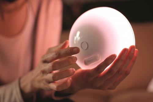 Hue Go -  facing right, white, handheld